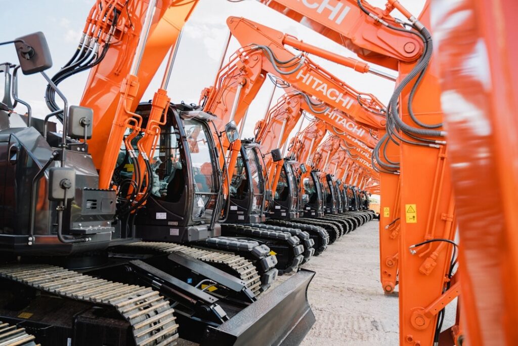Hitachi ZX-5N series mini excavators lined up - hitachi mini excavator dealer near me