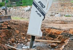 An FRD breaker on an excavator breaking up rock